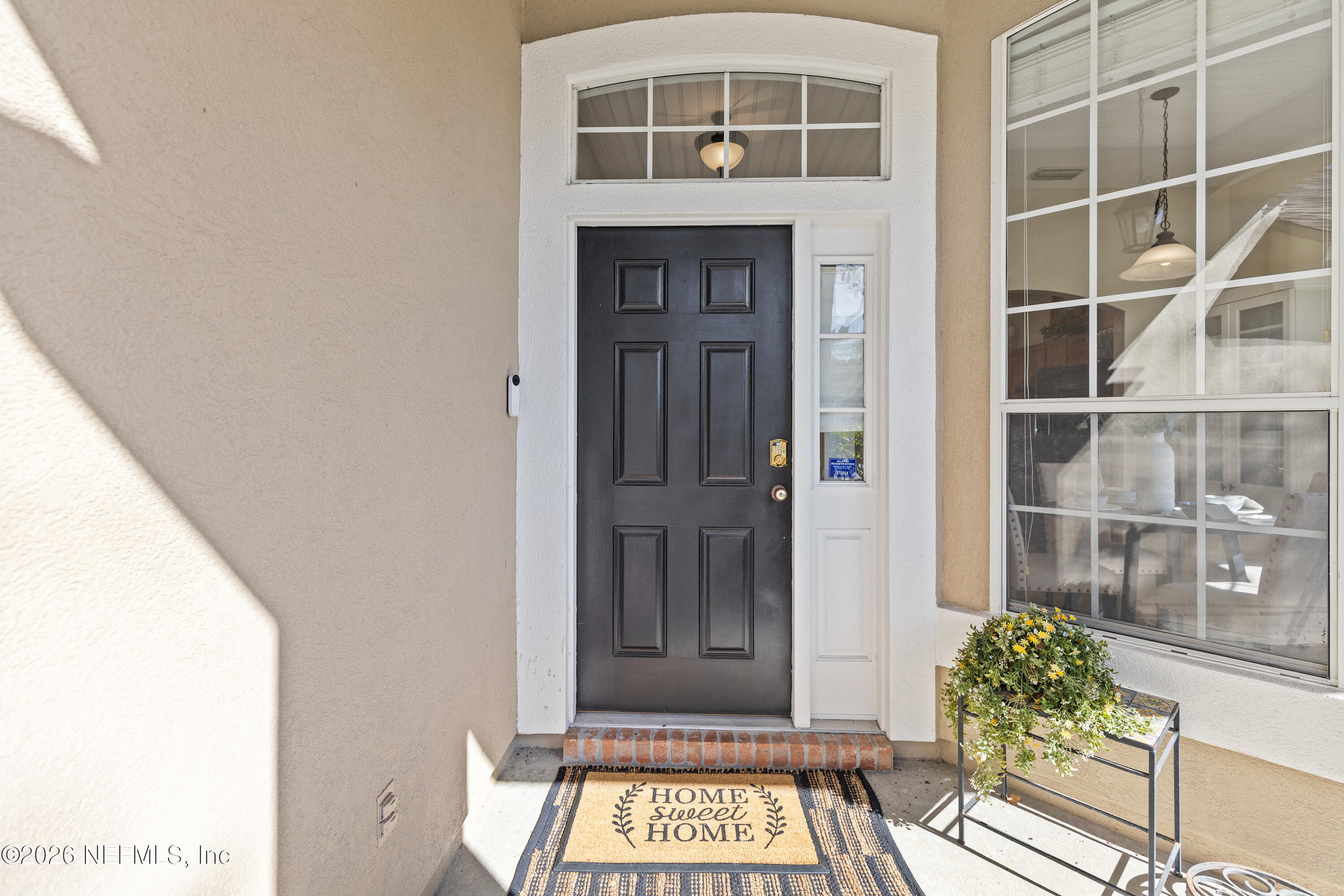 827 Briarcreek Road Jacksonville, FL 32225 - Photo 4 of 44 a front view of a house with a glass door
