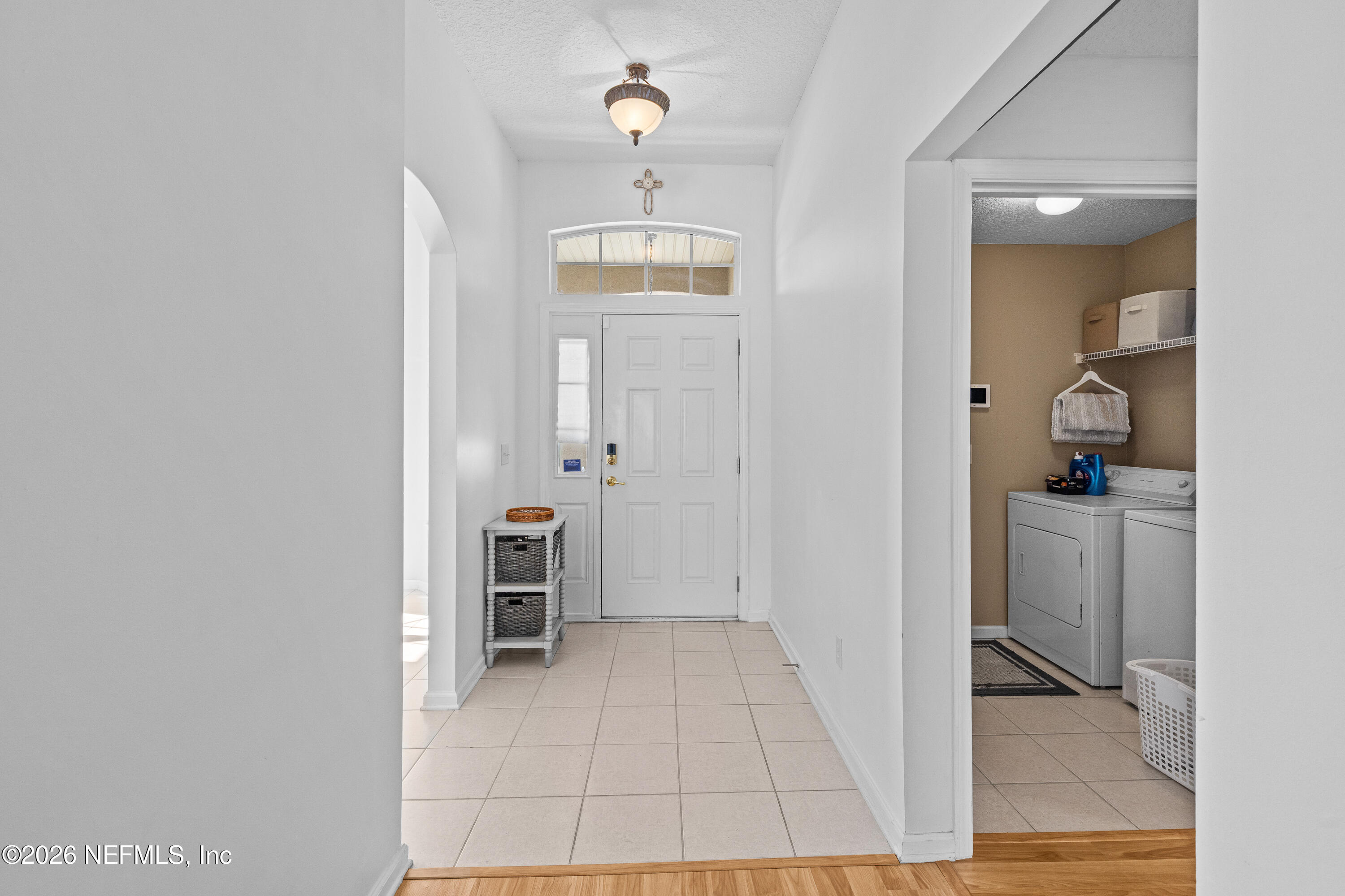 827 Briarcreek Road Jacksonville, FL 32225 - Photo 7 of 44 a view of a hallway with wooden floor and a living room