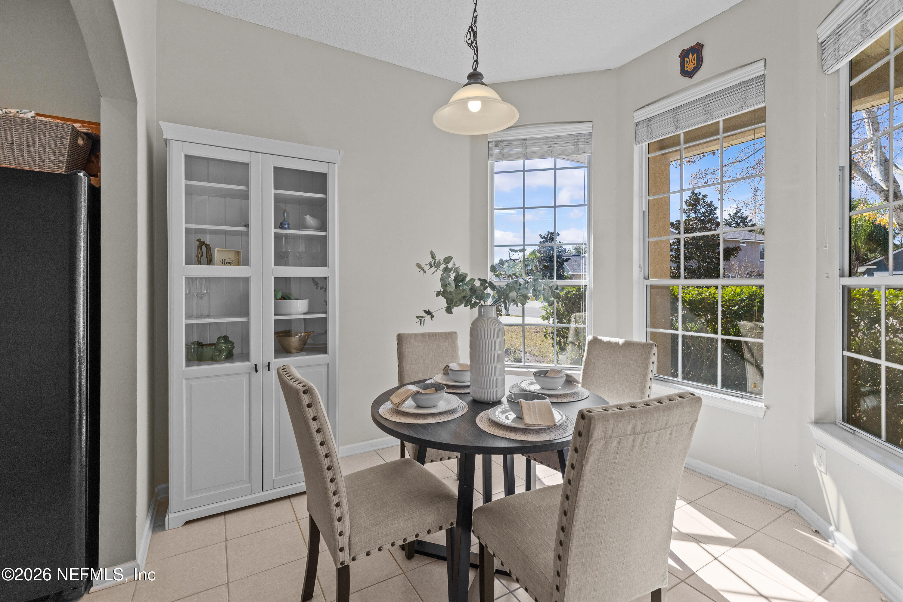 827 Briarcreek Road Jacksonville, FL 32225 - Photo 8 of 44 a view of a dining room with furniture window and wooden floor