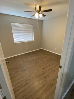 a view of an empty room with a window