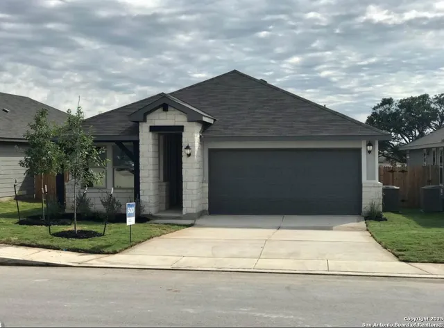 a front view of a house with garage