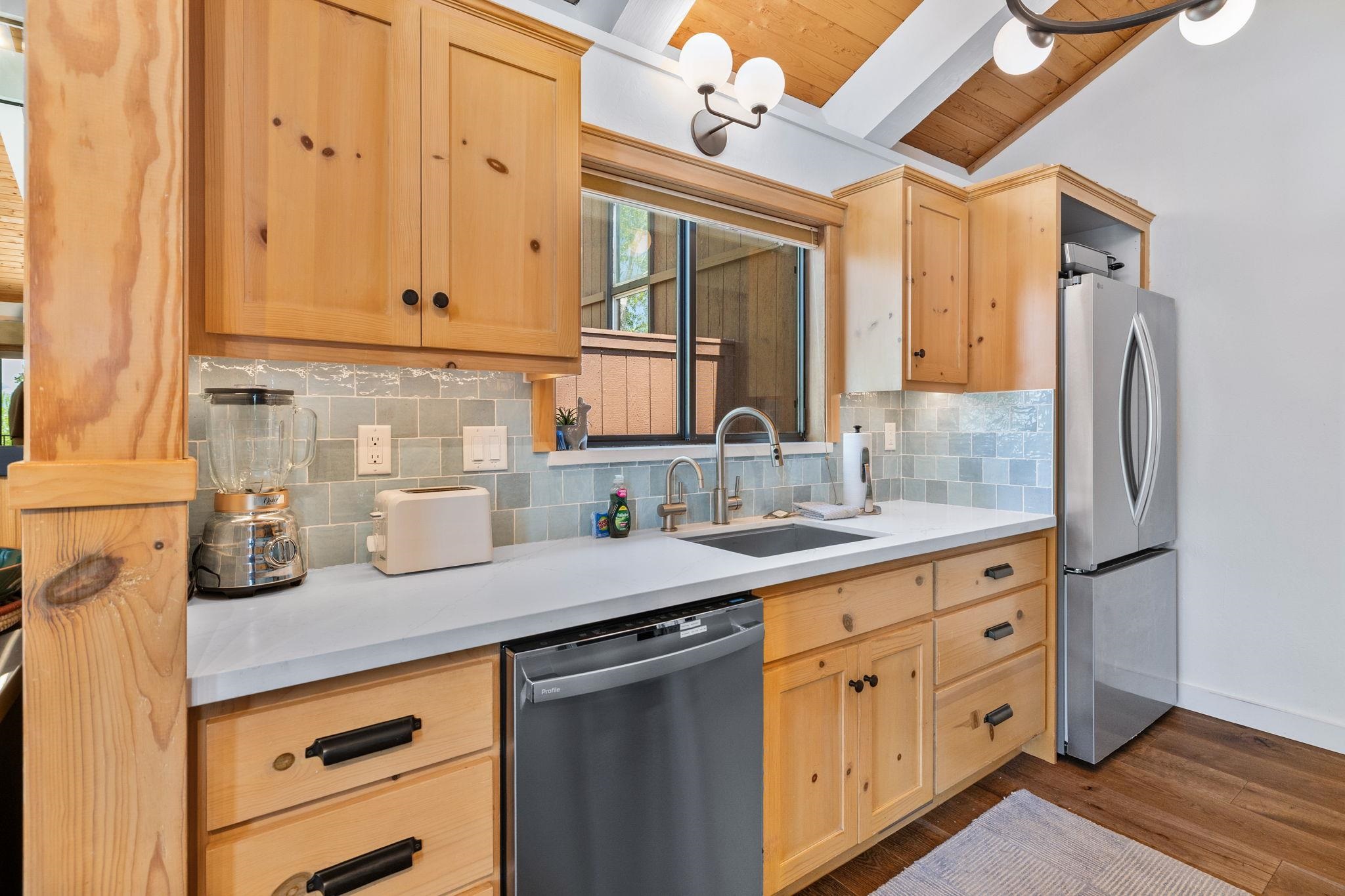 2560 Lake Forest Road, Unit 24 Tahoe City, CA 96145 - Photo 5 of 28 a kitchen with cabinets appliances and a sink