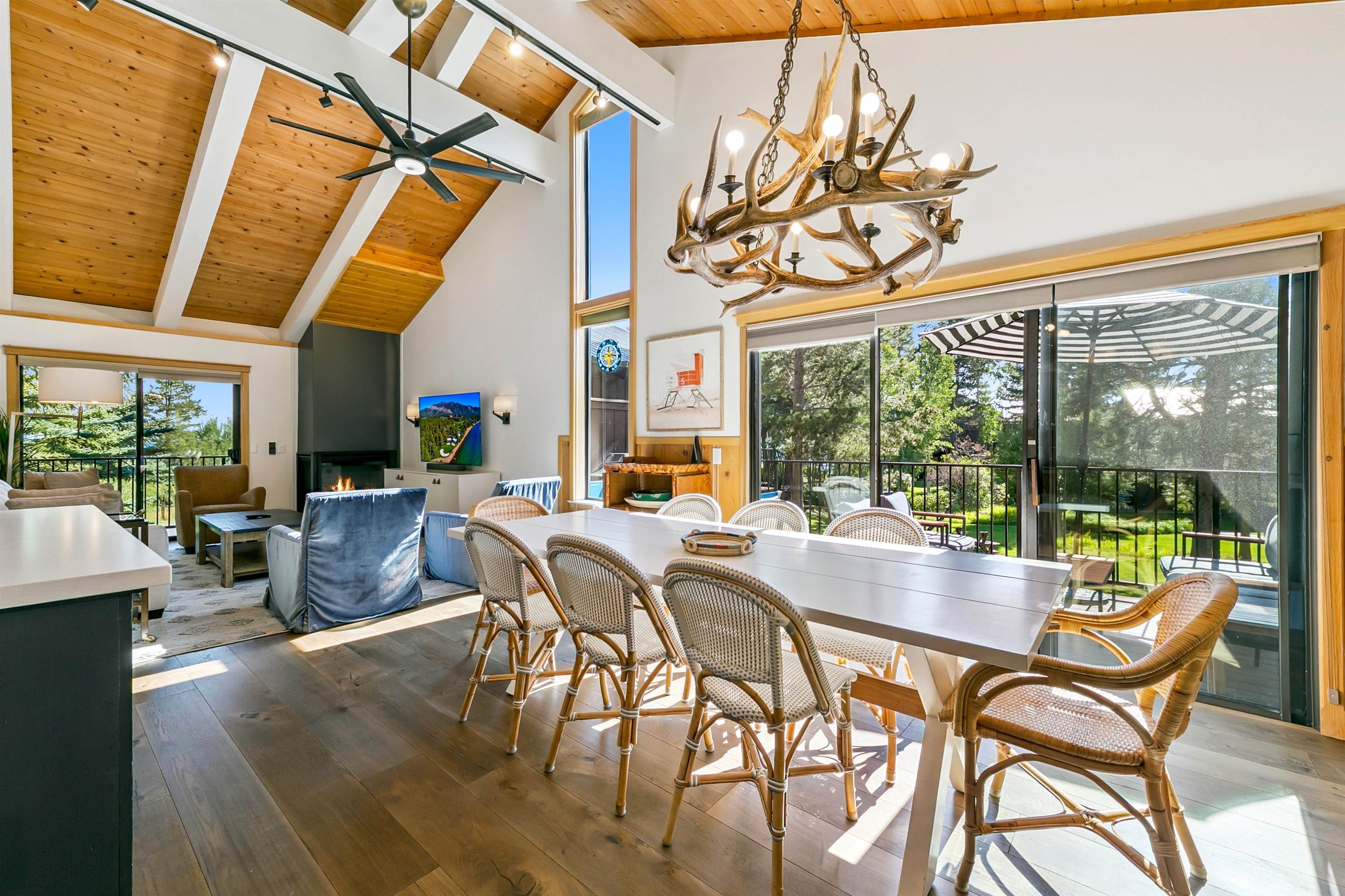 2560 Lake Forest Road, Unit 24 Tahoe City, CA 96145 - Photo 7 of 28 a dining room with furniture wooden floor and a potted plant