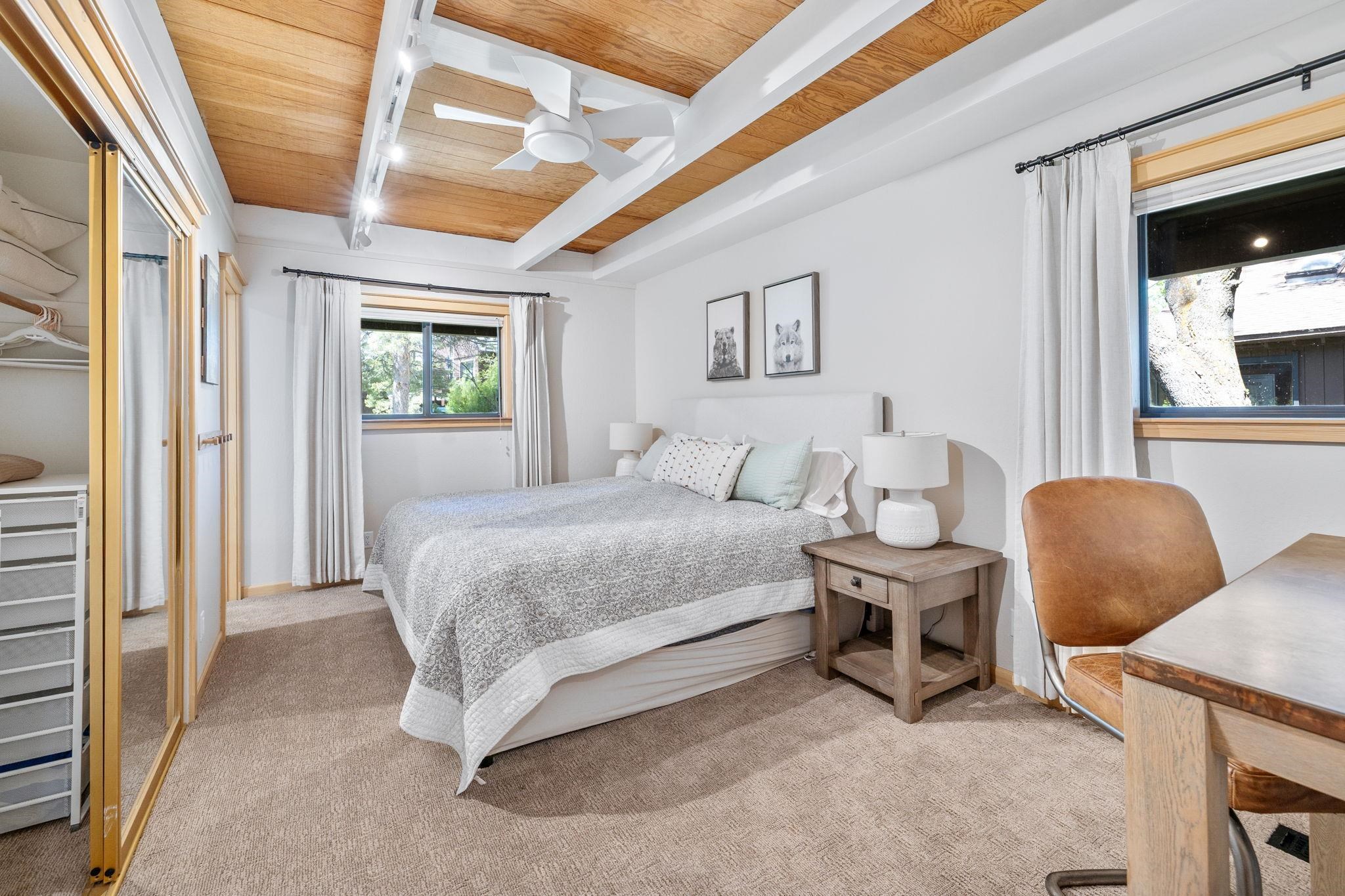 2560 Lake Forest Road, Unit 24 Tahoe City, CA 96145 - Photo 8 of 28 a spacious bedroom with a bed and a window