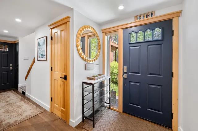 a bedroom with a bed and a large window