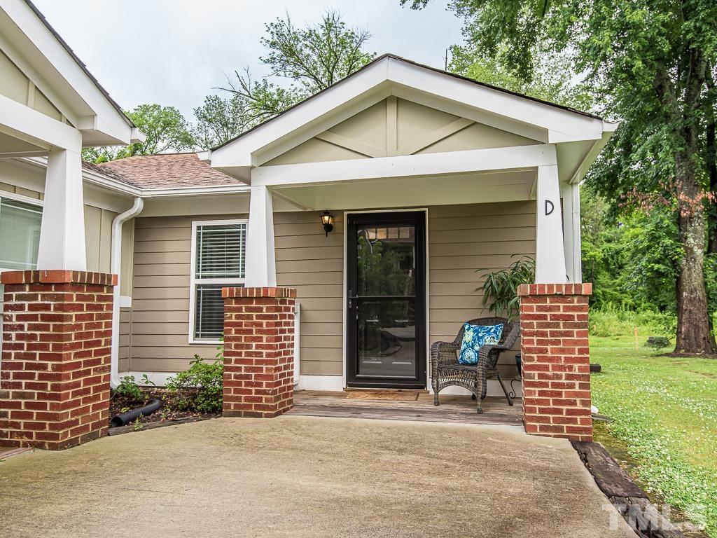 1312 South State Street, Unit D Raleigh, NC 27610 - Photo 1 of 19 a front view of a house with a garden