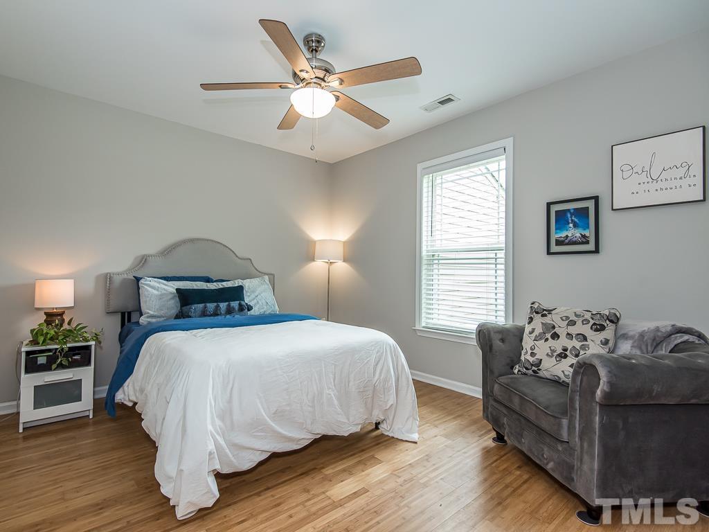 1312 South State Street, Unit D Raleigh, NC 27610 - Photo 11 of 19 a bedroom with a bed and window