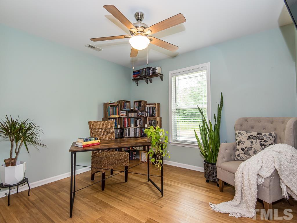 1312 South State Street, Unit D Raleigh, NC 27610 - Photo 12 of 19 a workspace with furniture and a potted plant