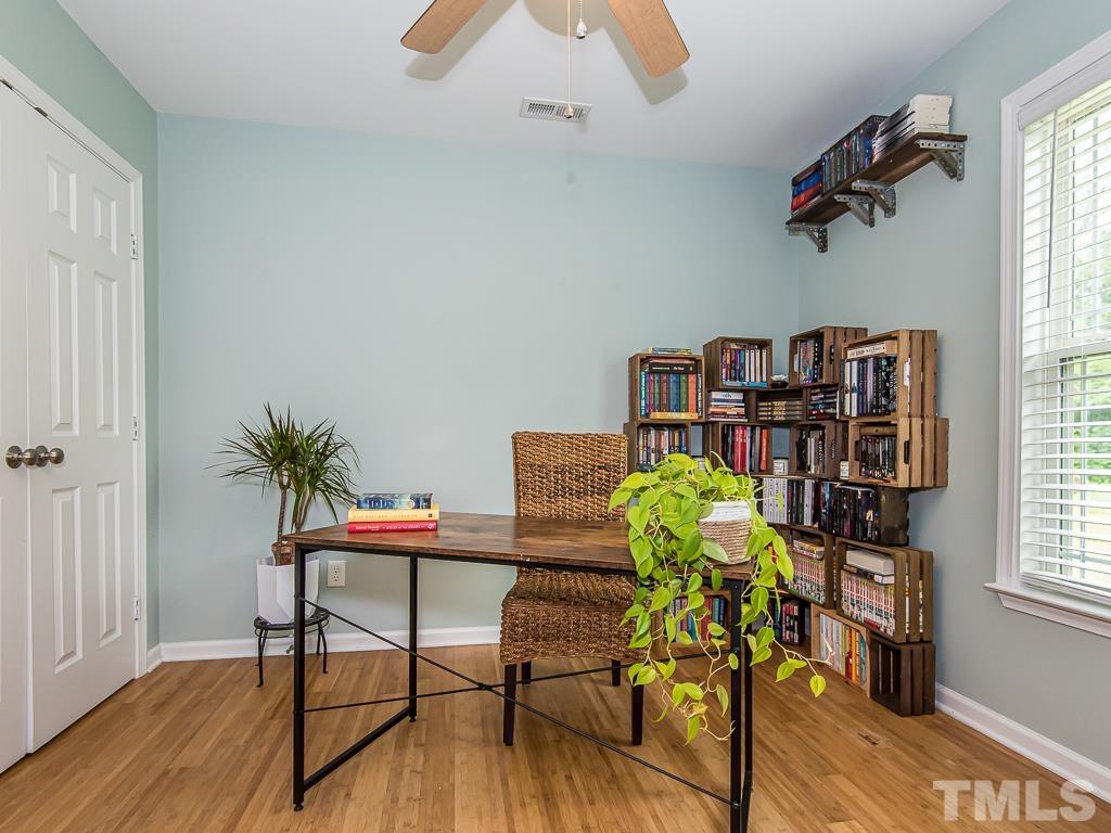1312 South State Street, Unit D Raleigh, NC 27610 - Photo 13 of 19 a workspace with furniture and a window
