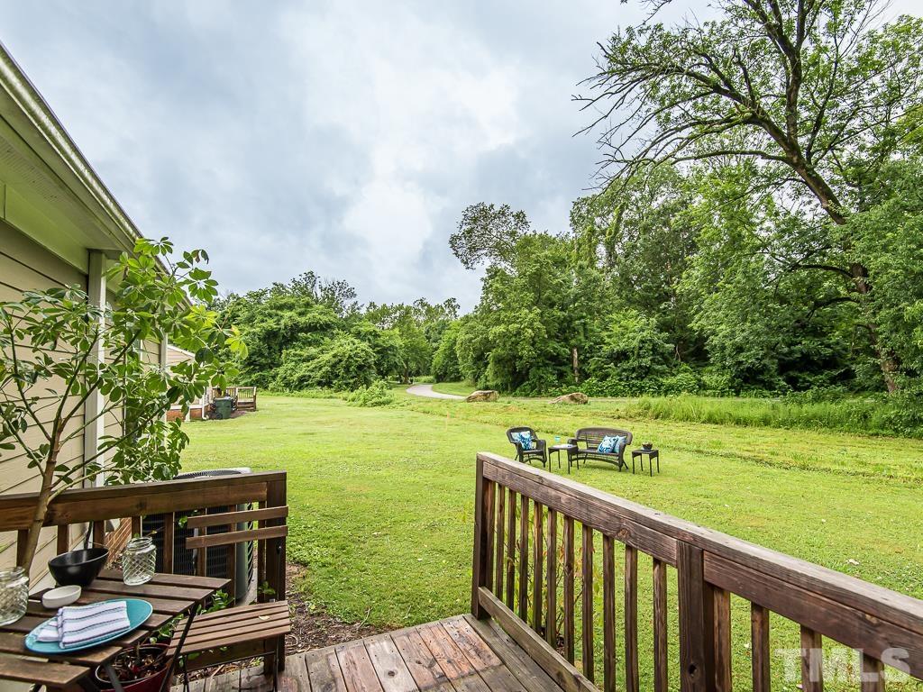 1312 South State Street, Unit D Raleigh, NC 27610 - Photo 18 of 19 a view of a wooden deck and a yard