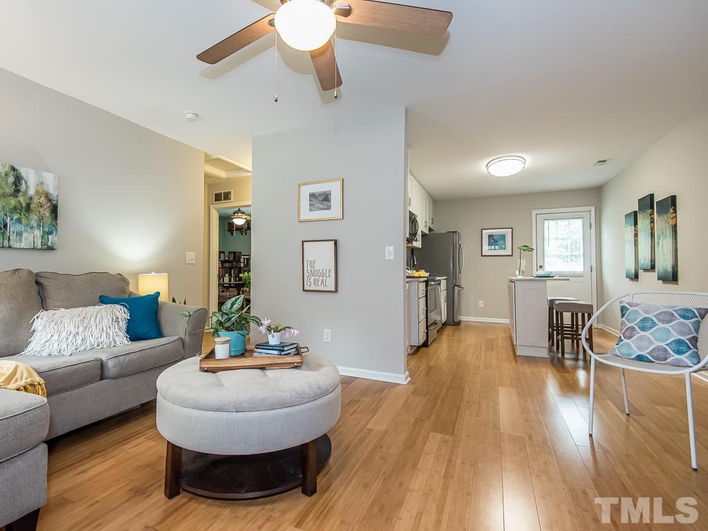 1312 South State Street, Unit D Raleigh, NC 27610 - Photo 3 of 19 a living room with furniture and a wooden floor