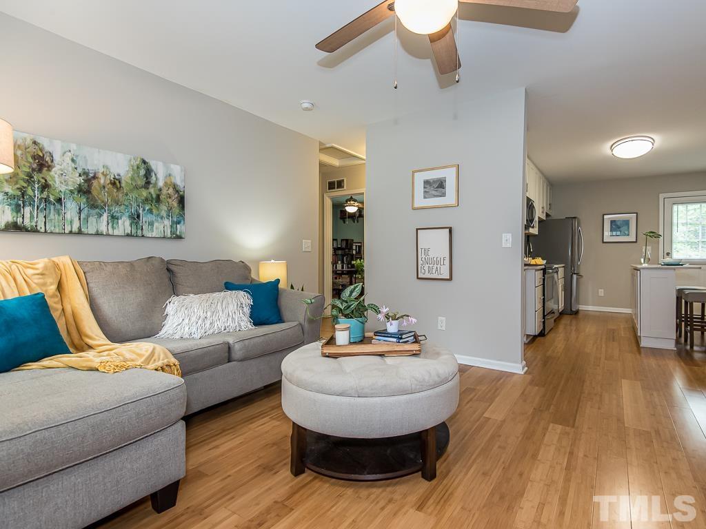 1312 South State Street, Unit D Raleigh, NC 27610 - Photo 5 of 19 a living room with furniture and a wooden floor