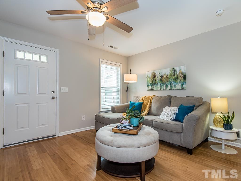 1312 South State Street, Unit D Raleigh, NC 27610 - Photo 6 of 19 a living room with furniture and a large window