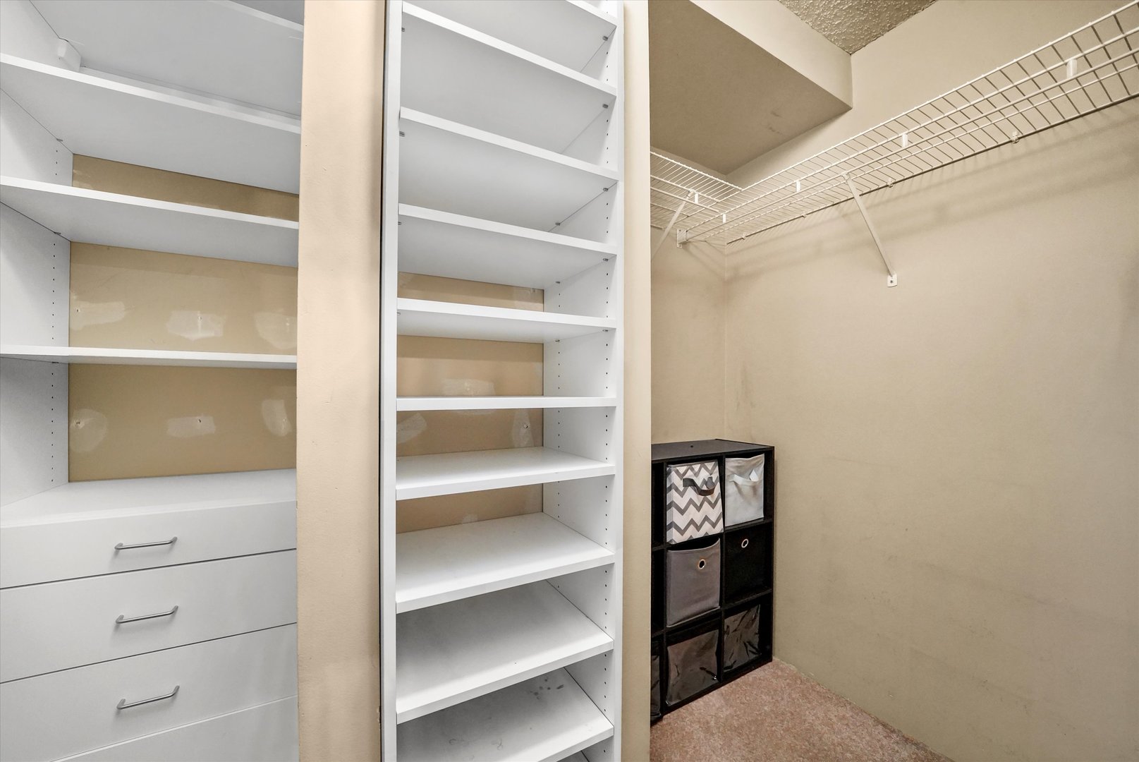 1122 North Clark Street, Unit 2202 Chicago, IL 60610 - Photo 7 of 12 a view of walk in closet with empty racks