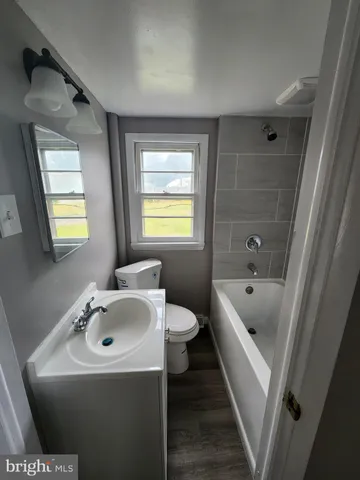 a bathroom with a bathtub and toilet