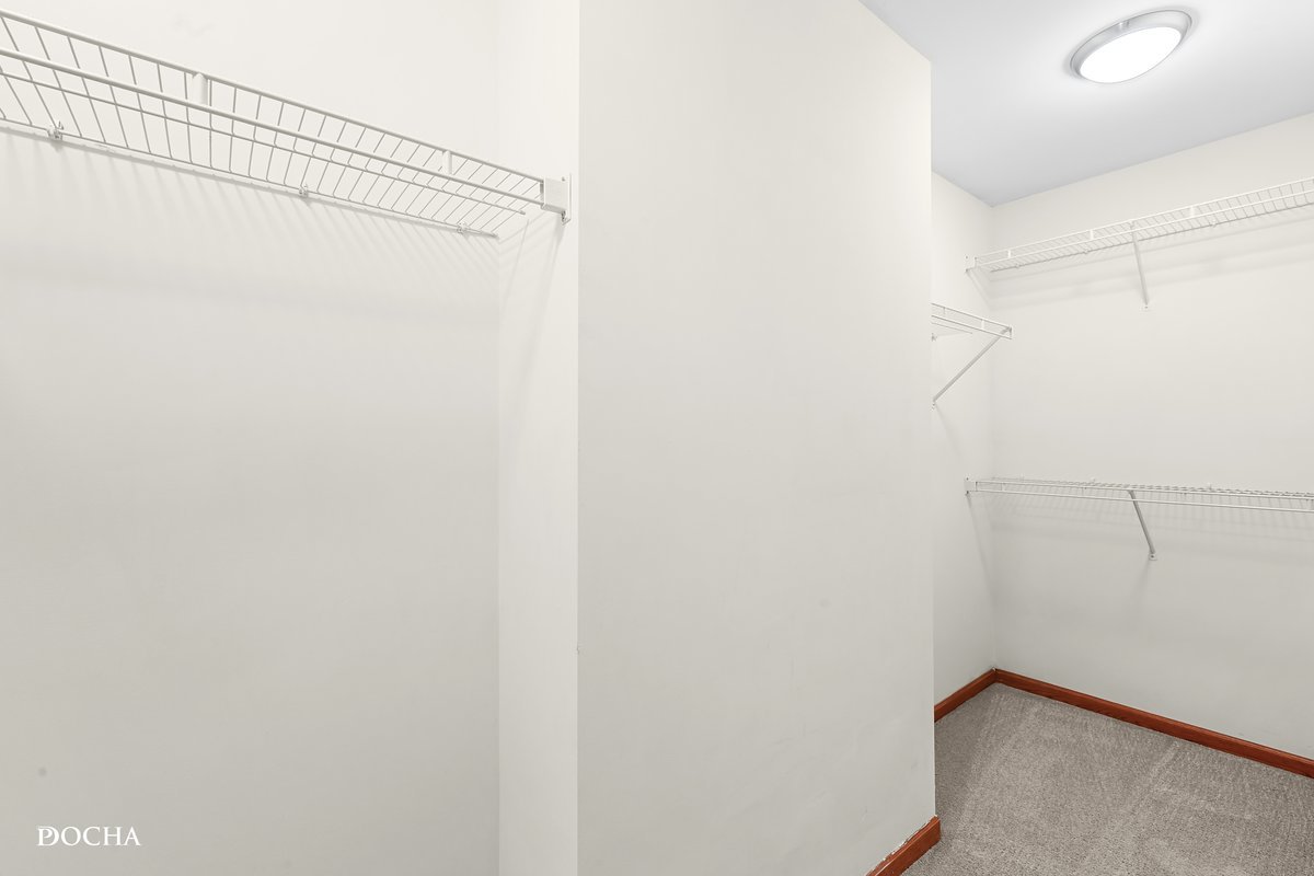 2413 Roxbury Lane Montgomery, IL 60538 - Photo 15 of 22 a view of a room with racks on the wall
