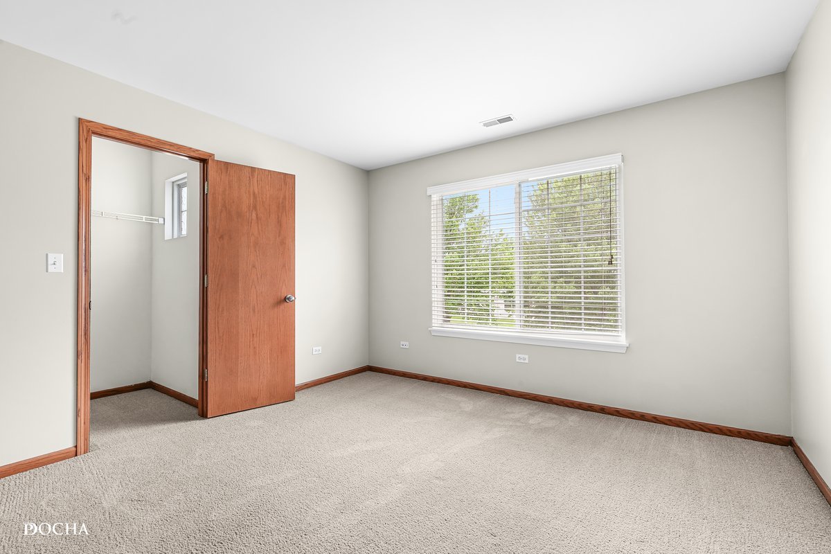 2413 Roxbury Lane Montgomery, IL 60538 - Photo 16 of 22 a view of an empty room with a window