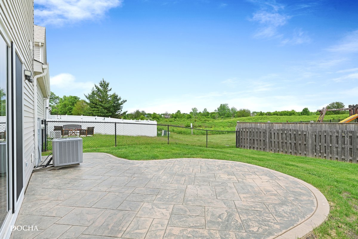 2413 Roxbury Lane Montgomery, IL 60538 - Photo 19 of 22 a view of a backyard with grass and fence