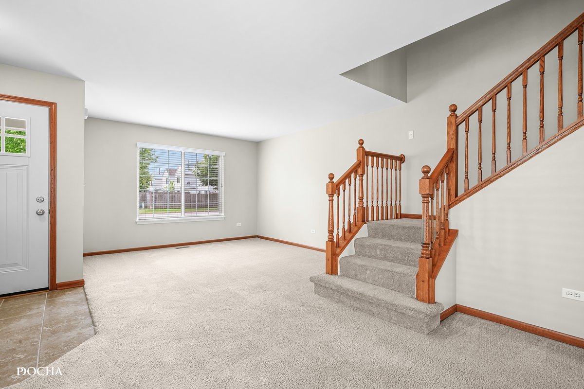 2413 Roxbury Lane Montgomery, IL 60538 - Photo 3 of 22 a view of an entryway with stairs