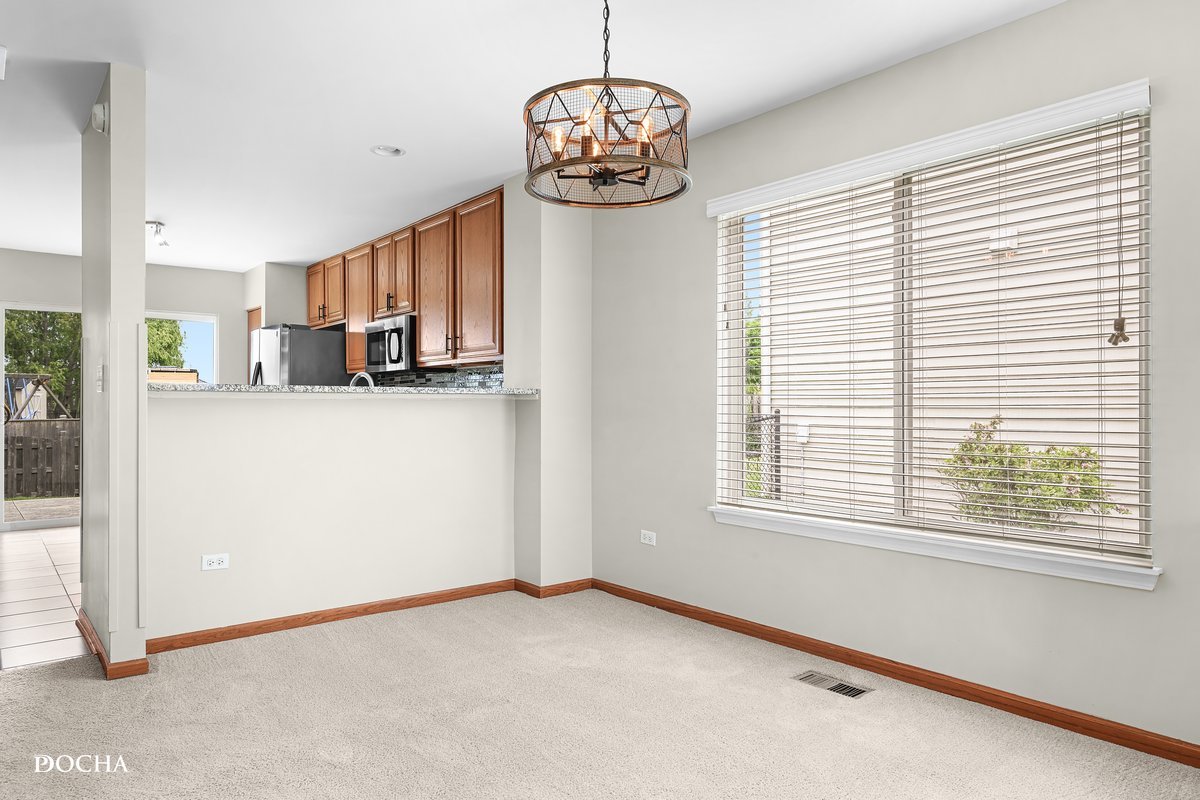 2413 Roxbury Lane Montgomery, IL 60538 - Photo 4 of 22 a view of a kitchen with large window