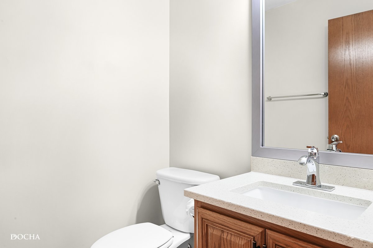 2413 Roxbury Lane Montgomery, IL 60538 - Photo 10 of 22 a bathroom with a sink a toilet and mirror