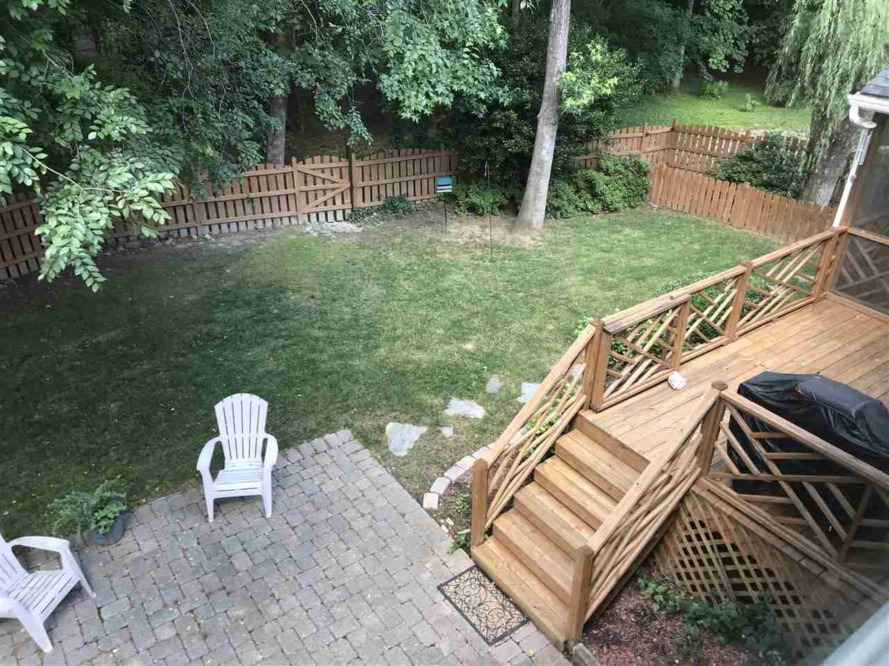 2900 Dahlgreen Road Raleigh, NC 27615 - Photo 4 of 25 View of the fabulous backyard with screened porch, deck and patio. Just open the gate and step onto the walking trails. Fenced yard with fenced dog run. Bridge across creek behind fence to remain in "as is" condition. Back Yard
