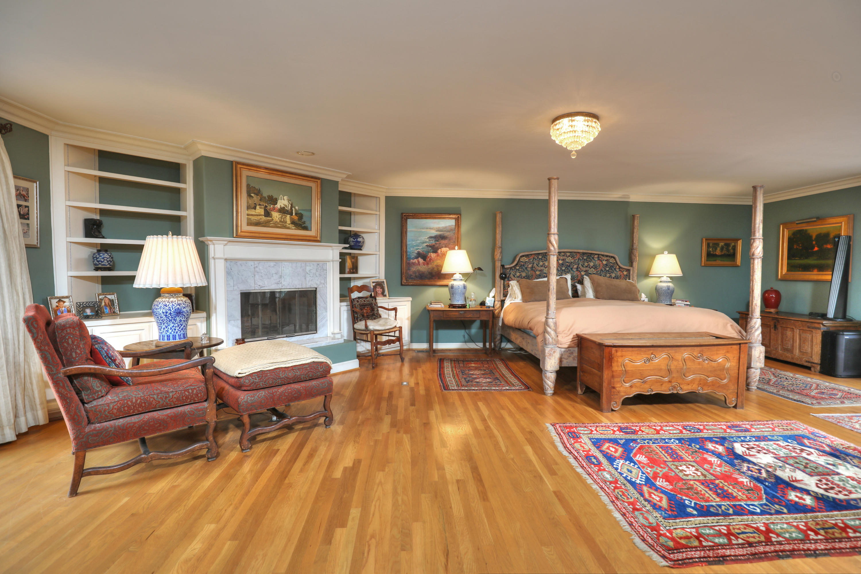 189 Hermosillo Road Montecito, CA 93108 - Photo 16 of 23 a bedroom with furniture and a fireplace