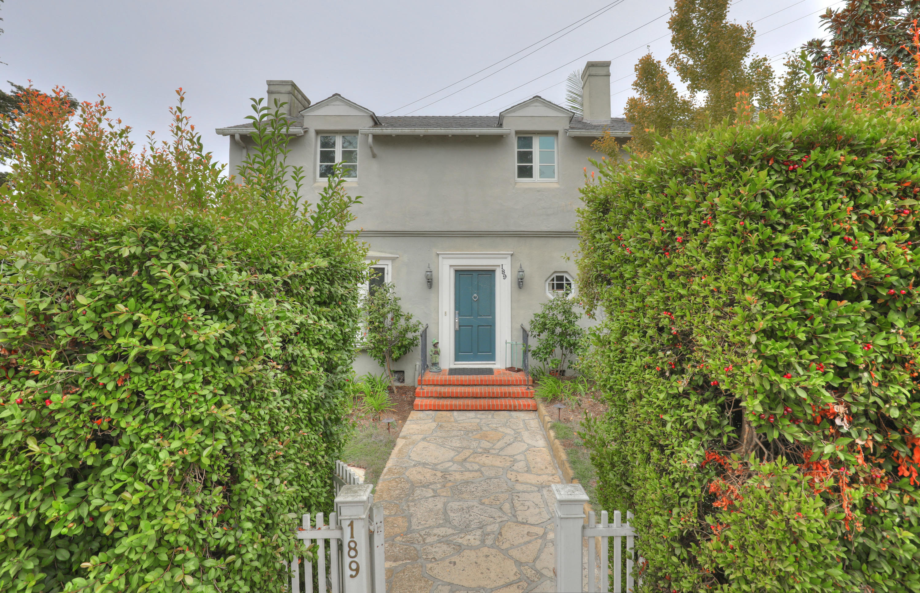 189 Hermosillo Road Montecito, CA 93108 - Photo 2 of 23 a front view of a house with a yard and trees