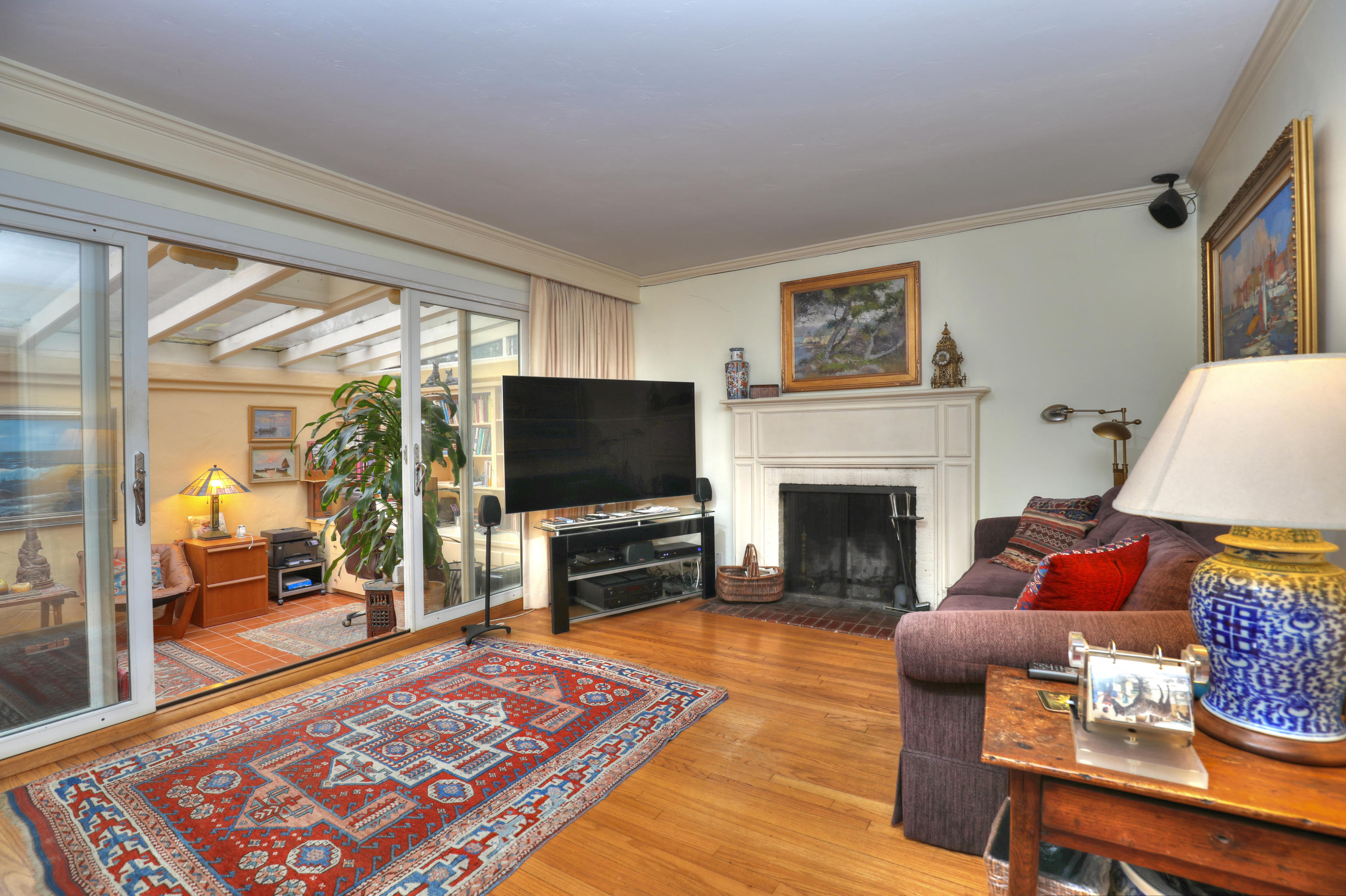 189 Hermosillo Road Montecito, CA 93108 - Photo 10 of 23 a living room with furniture a rug and a fireplace