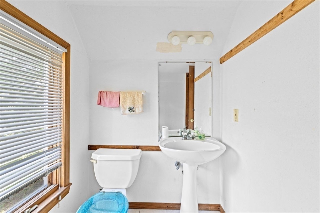 26 Damons Point Circle Marshfield, MA 02050 - Photo 17 of 35 a bathroom with a sink a mirror and a toilet