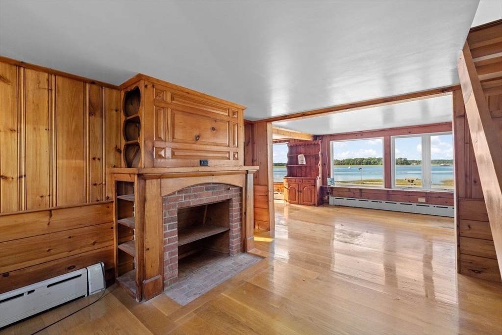 26 Damons Point Circle Marshfield, MA 02050 - Photo 2 of 35 a view of livingroom with furniture fireplace and window