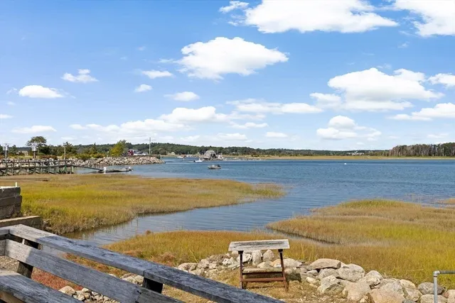 a view of swimming pool with seating area and barbeque oven