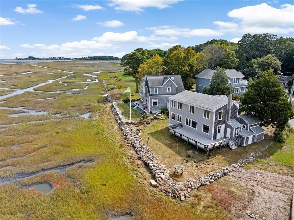 26 Damons Point Circle Marshfield, MA 02050 - Photo 26 of 35 a view of a lake with building in front of it