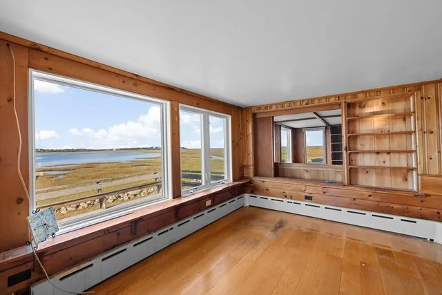 a view of livingroom with furniture fireplace and window