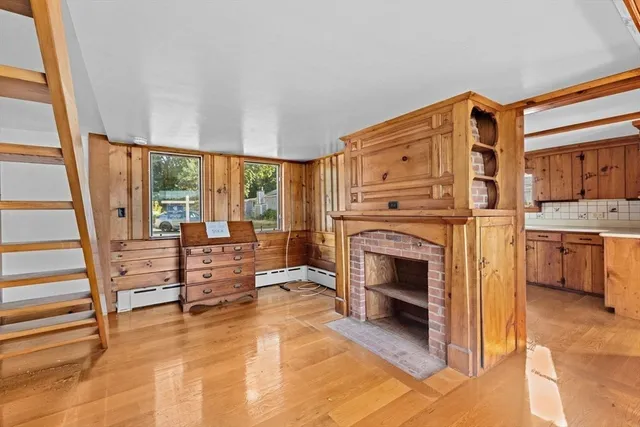 a view of a kitchen with a sink and cabinets