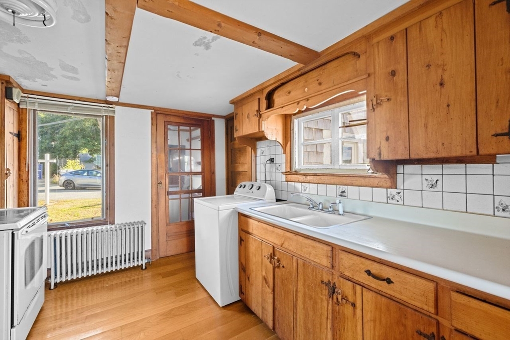26 Damons Point Circle Marshfield, MA 02050 - Photo 5 of 35 a view of a kitchen with a sink and cabinets