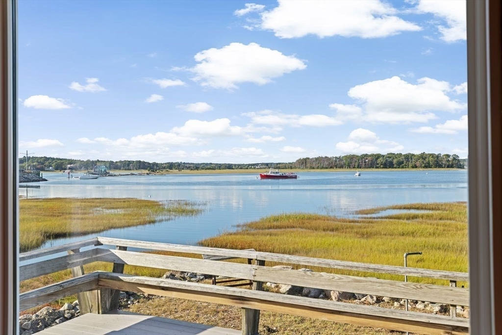 26 Damons Point Circle Marshfield, MA 02050 - Photo 8 of 35 a view of a lake with a city