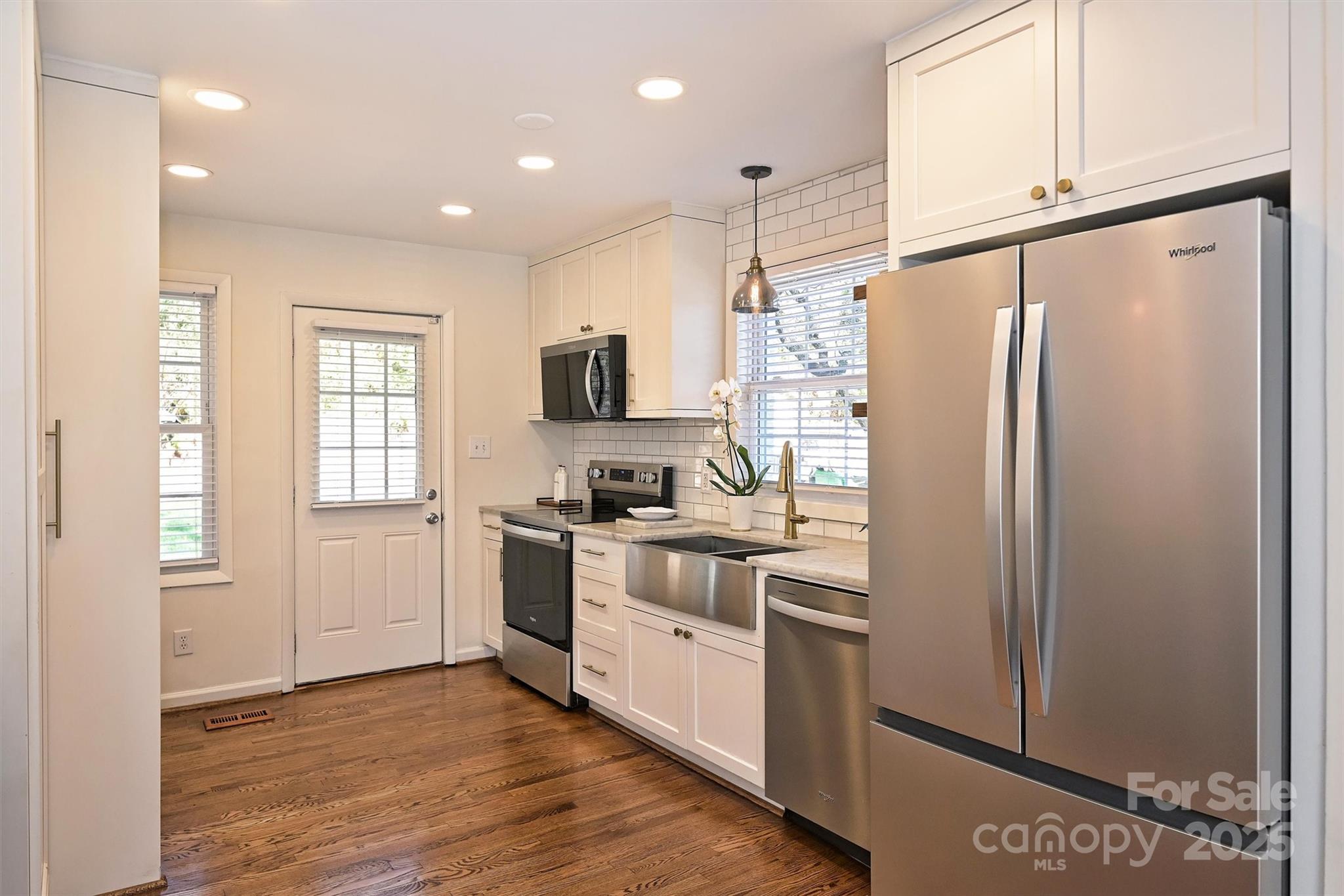 2730 Royston Road Charlotte, NC 28208 - Photo 12 of 40 a kitchen with stainless steel appliances a refrigerator sink and microwave