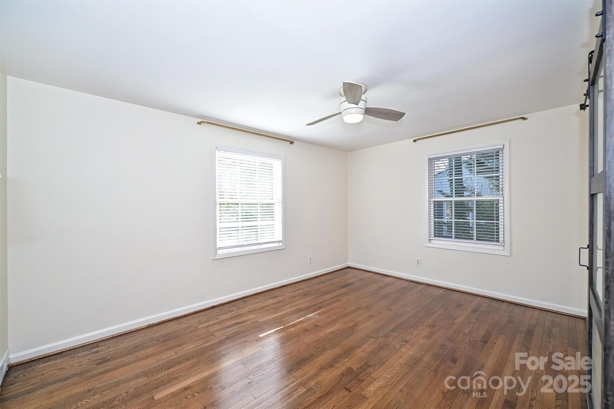 2730 Royston Road Charlotte, NC 28208 - Photo 20 of 40 a view of an empty room with wooden floor and a window