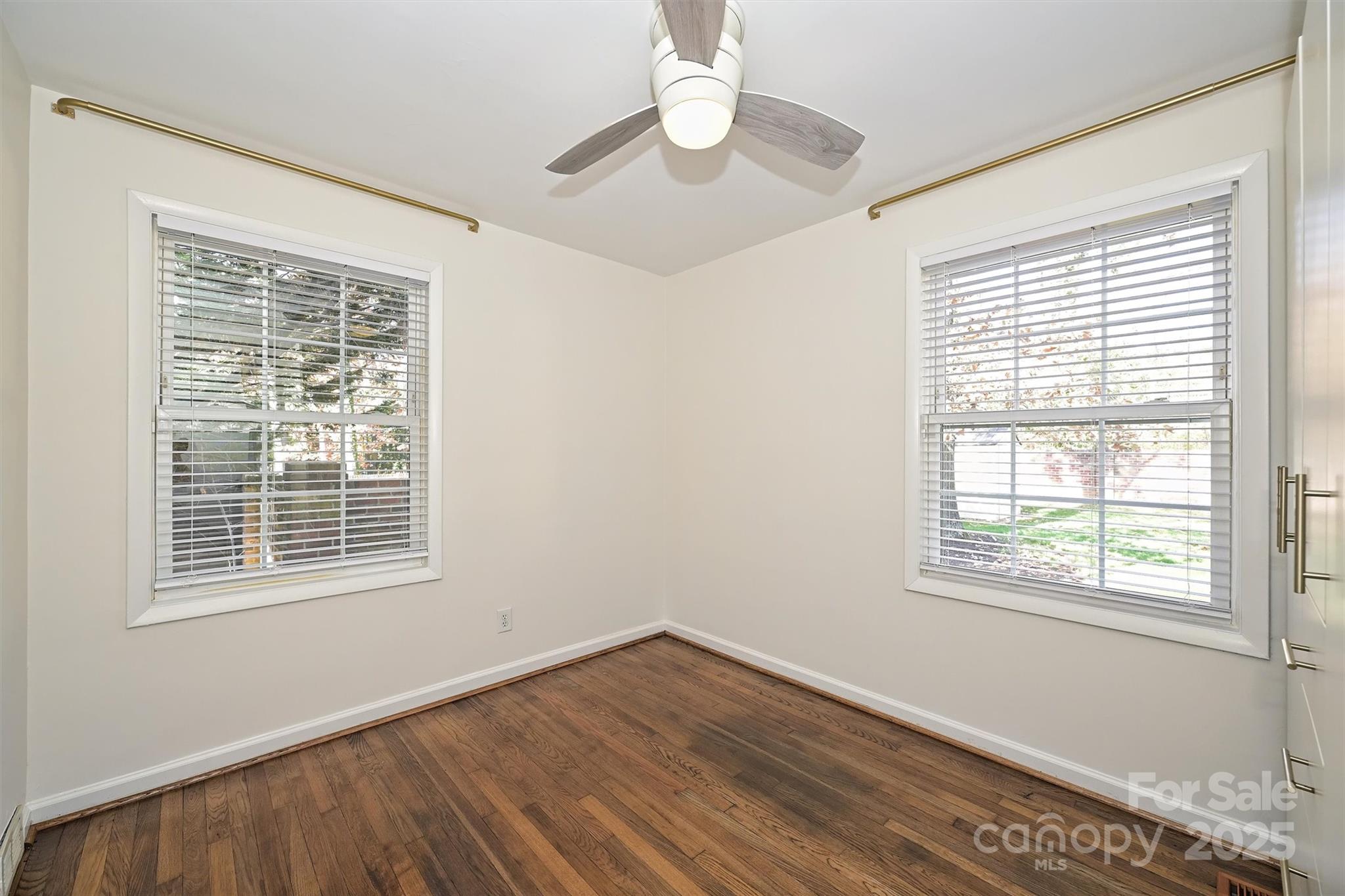 2730 Royston Road Charlotte, NC 28208 - Photo 27 of 40 a view of an empty room with wooden floor and a window
