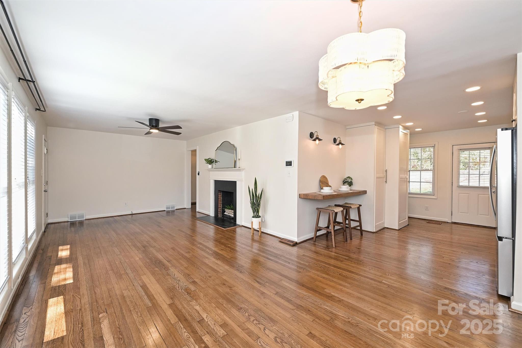 2730 Royston Road Charlotte, NC 28208 - Photo 7 of 40 an entryway with fireplace and wooden floor
