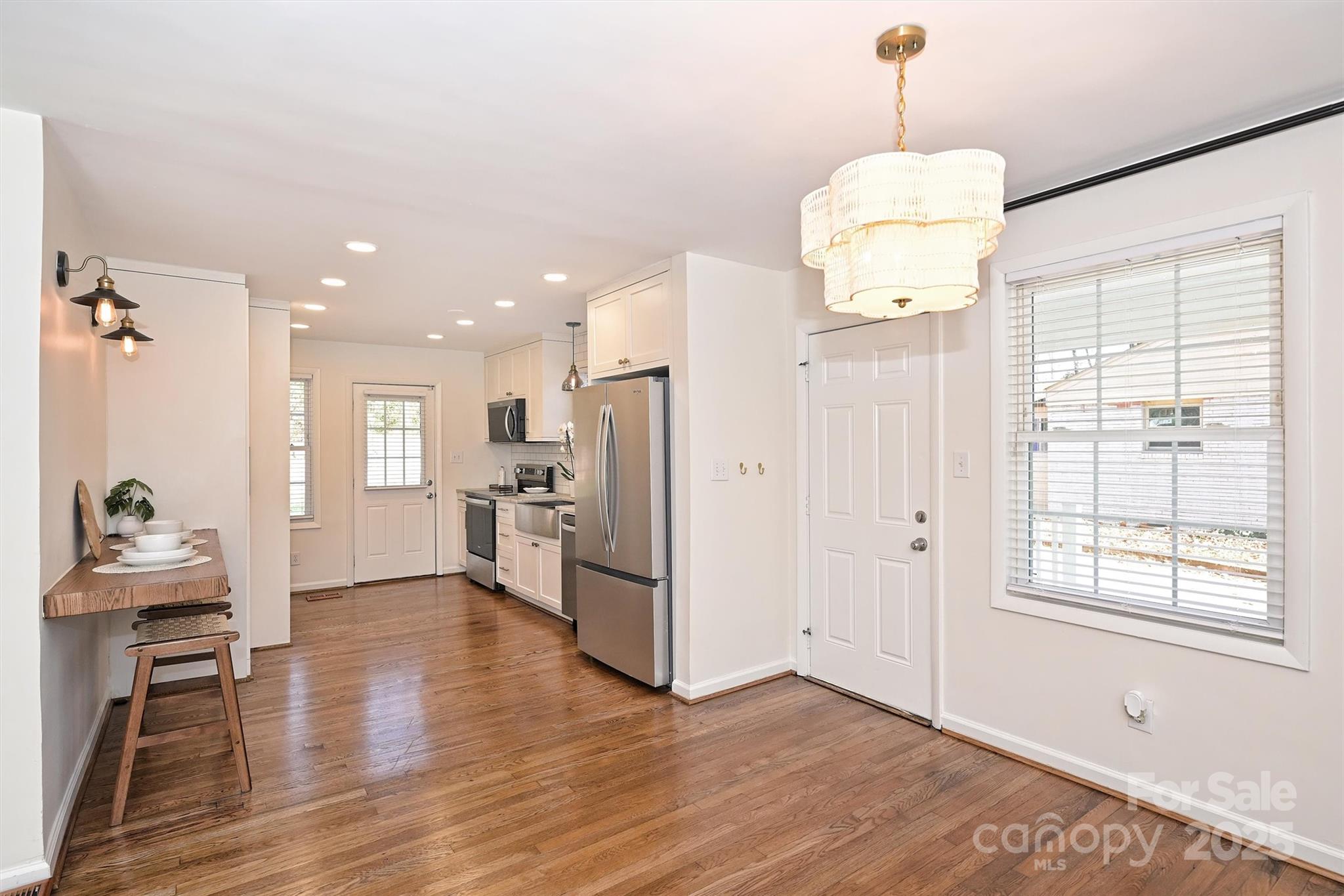 2730 Royston Road Charlotte, NC 28208 - Photo 10 of 40 a view of a kitchen and kitchen island hardwood floor and a ceiling fan