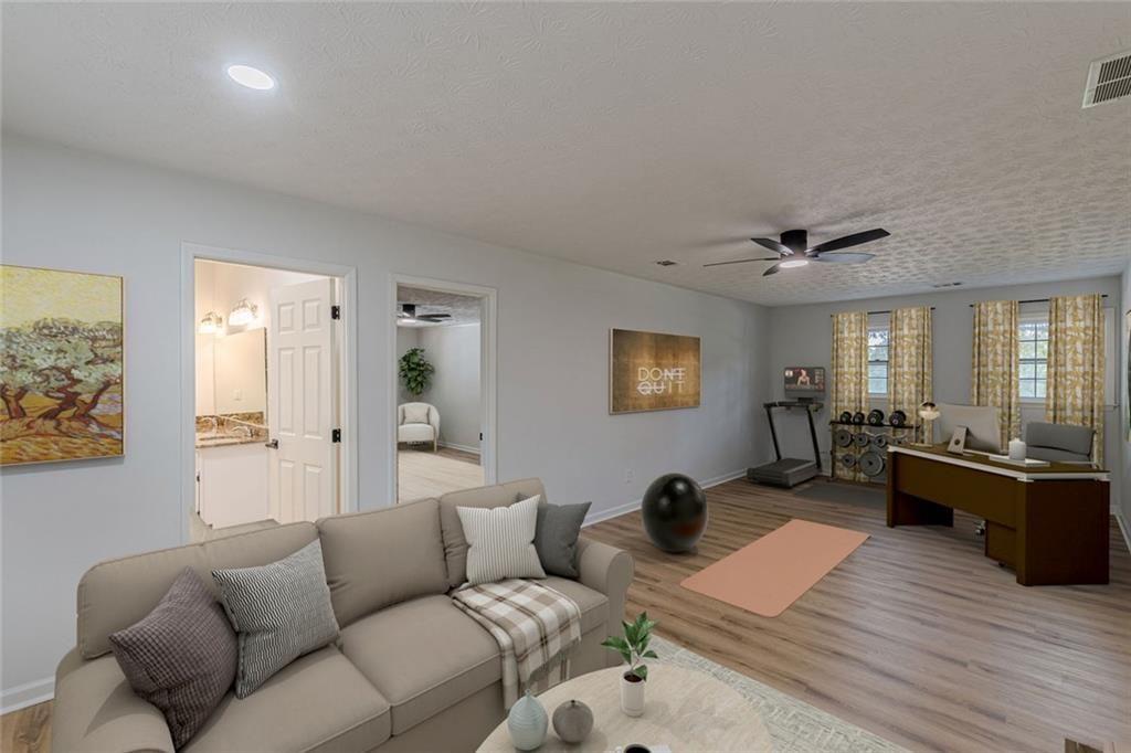 2011 Old Peachtree Road Northwest Duluth, GA 30097 - Photo 20 of 37 a living room with furniture window and wooden floor