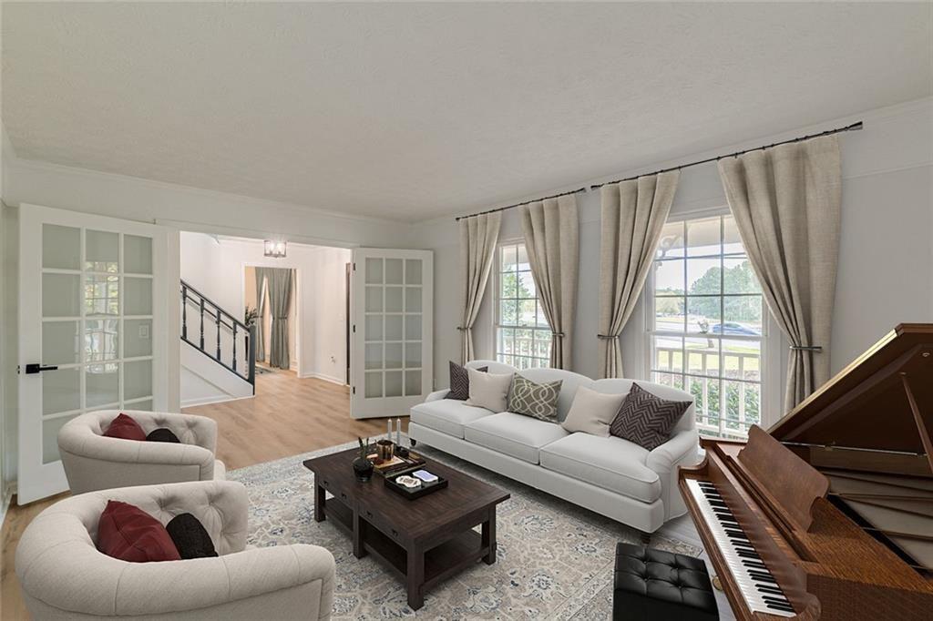 2011 Old Peachtree Road Northwest Duluth, GA 30097 - Photo 2 of 37 a living room with furniture and a large window