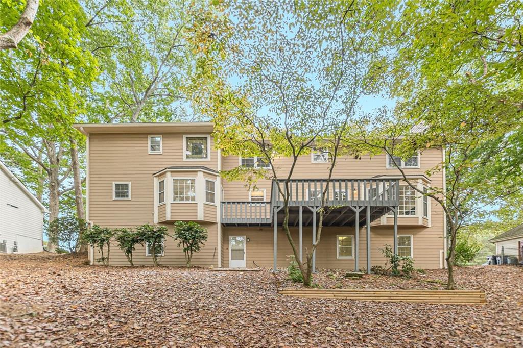 2011 Old Peachtree Road Northwest Duluth, GA 30097 - Photo 36 of 37 a front view of a house with garden
