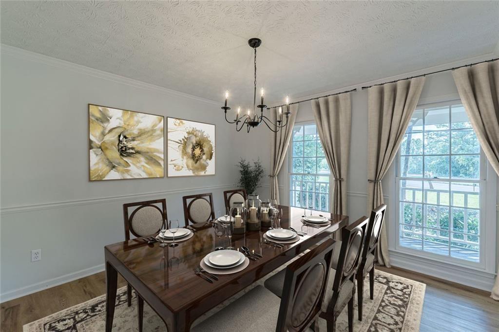2011 Old Peachtree Road Northwest Duluth, GA 30097 - Photo 6 of 37 a view of a dining room with furniture wooden floor and chandelier