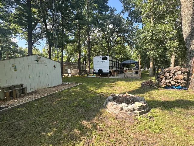 a view of a house with swimming pool and sitting area