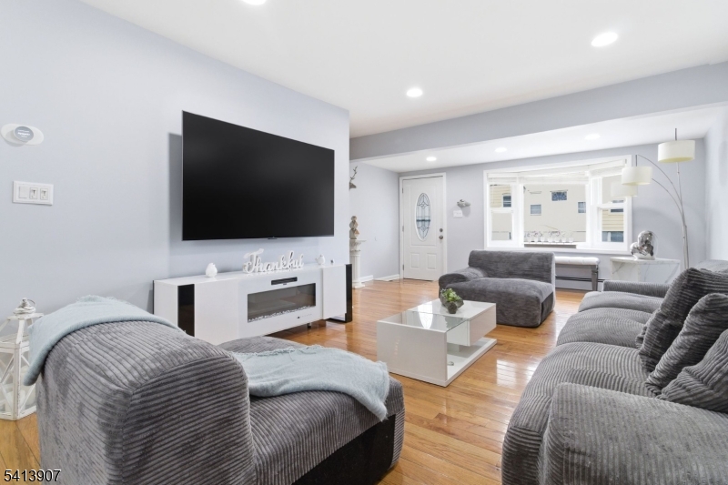 32 Cedar Avenue Elizabeth, NJ 07202 - Photo 3 of 32 a living room with furniture and a flat screen tv