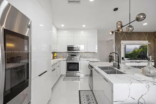 a view of a workspace with furniture and chandelier