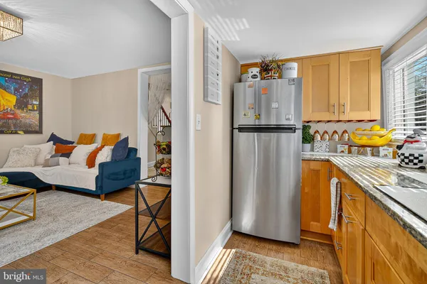 a kitchen with stainless steel appliances a refrigerator and a stove